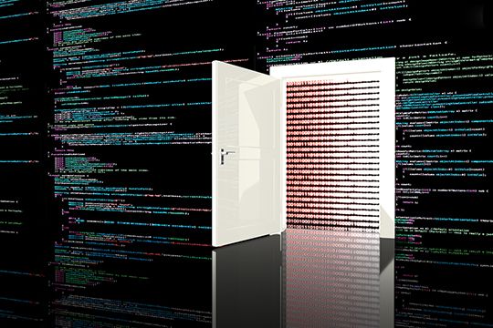 Door in a wall in a black room painted with computer code leading to a digital red background